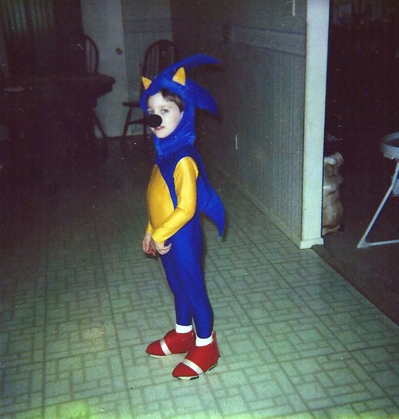 An eight year old child wearing a home made 'Sonic the Hedgehog' costume.